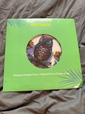 Colorful Owl Wind Spinner in Green Packaging
